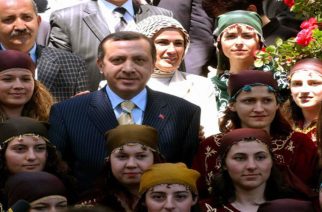 KOMOTINI, GREECE:  Turkish Prime Minister Recep Tayyip Erdogan (C) poses for a photo with traditional dressed Muslim girls in the northern Greek border town of Komotini 08 May 2004. Erdogan visited the county of Thrace, northern Greece, which counts some 115,000 Muslims. AFP PHOTO/ STR  (Photo credit should read STR/AFP/Getty Images)