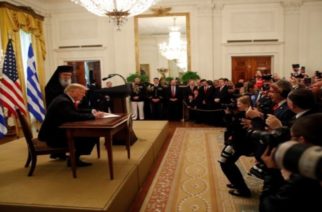 U.S. President Donald Trump signs a proclamation on Greek Independence Day during a celebration at the White House in Washington, U.S., March 18, 2019. REUTERS/Carlos Barria
