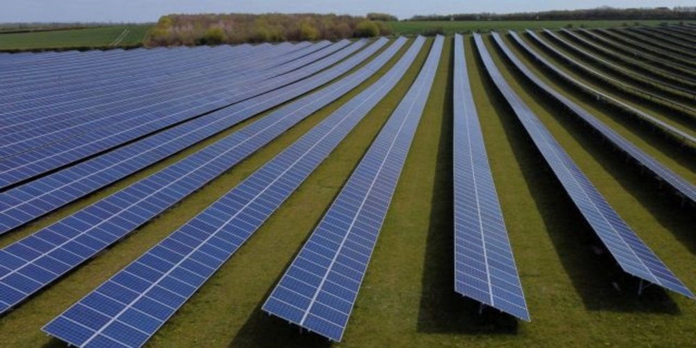 FILE PHOTO: A field of solar panels is seen near Royston, Britain, April 26, 2021. Picture taken with a drone. REUTERS/Matthew Childs/File Photo/File Photo